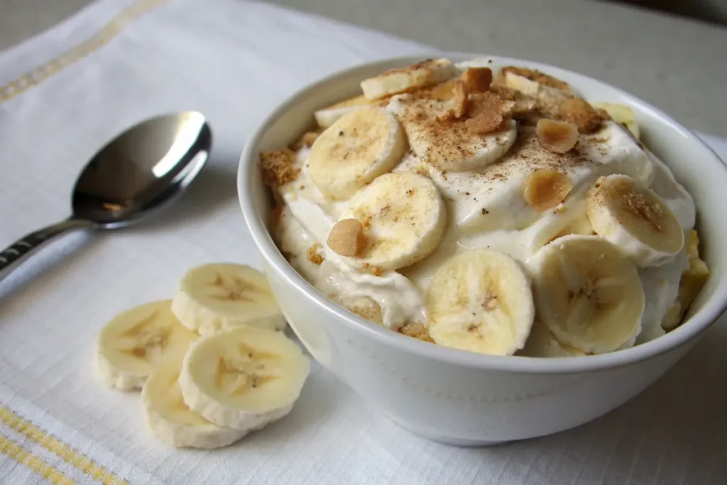 Delicious Magnolia Bakery Banana Pudding with layers of bananas, vanilla wafers, and whipped cream